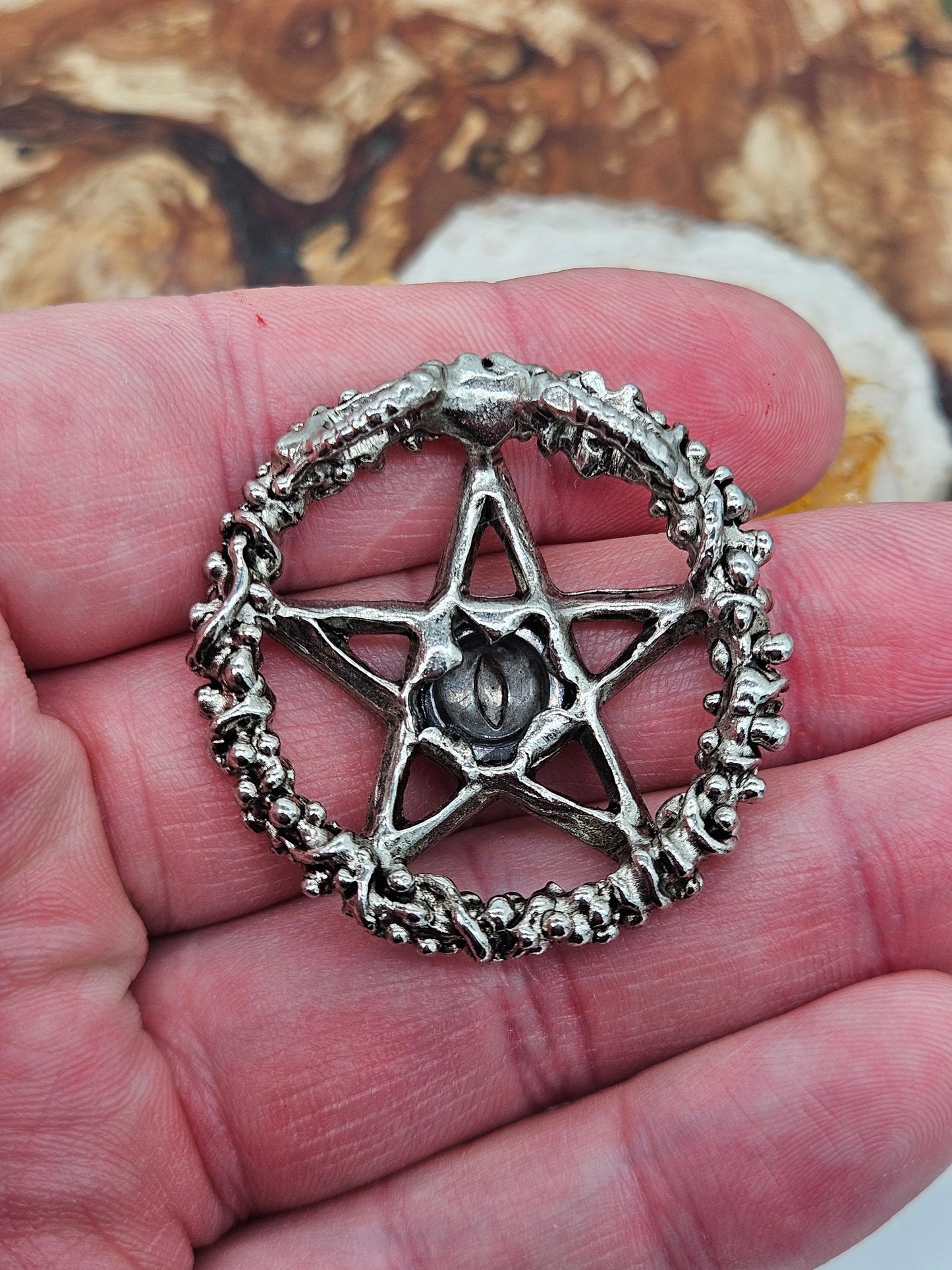 Axel Stocks Pentagram pendant with silver eye.
